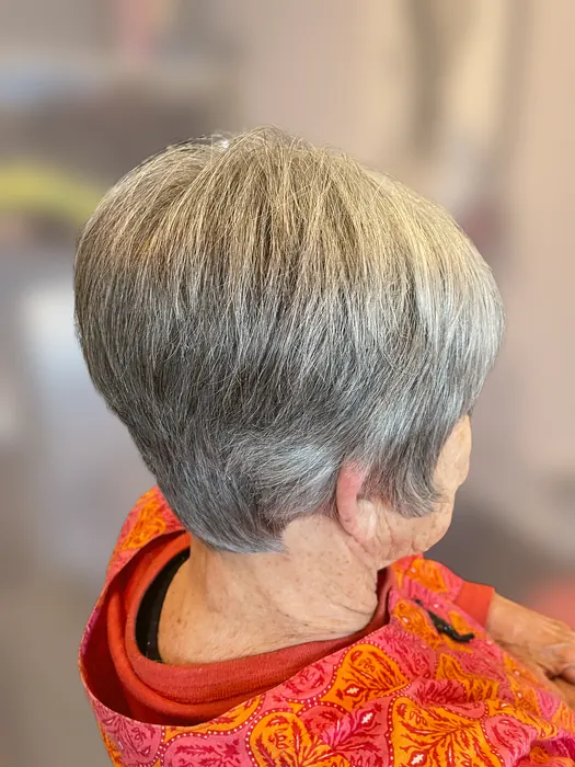 Short layered pixie cut on natural silver hair